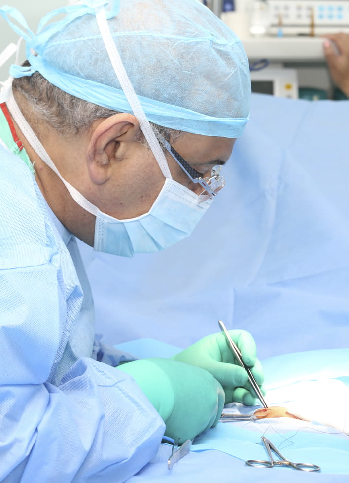 Doctor making a suture in operation room