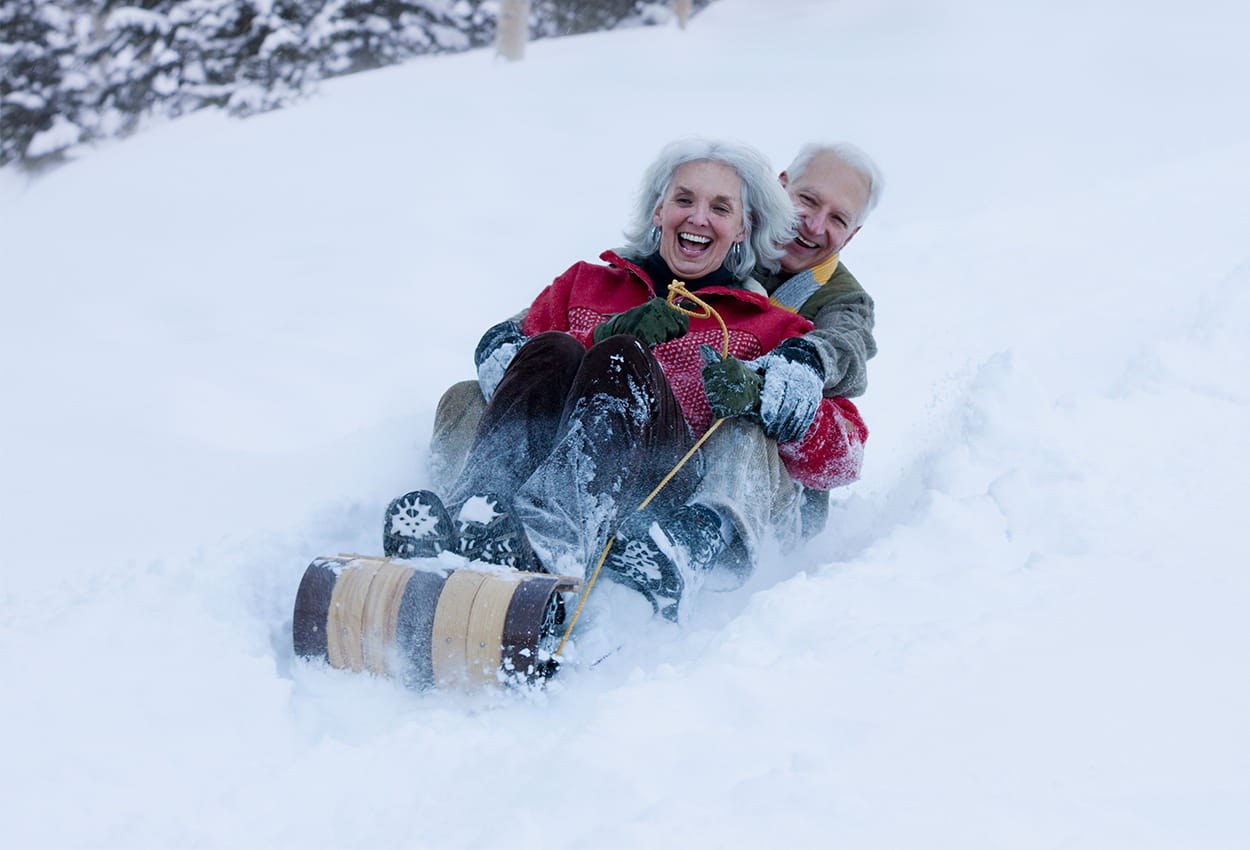 Couple sledding