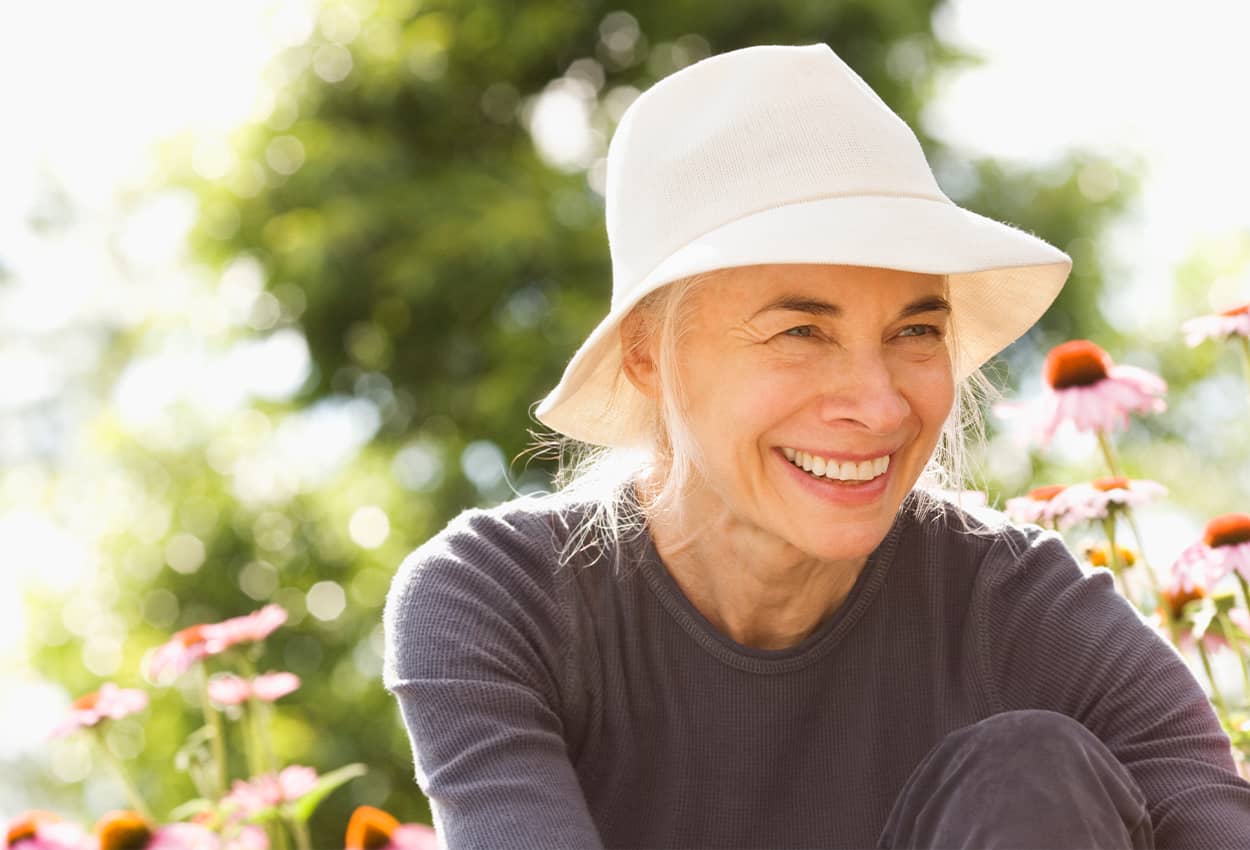 Woman in a hat smiling