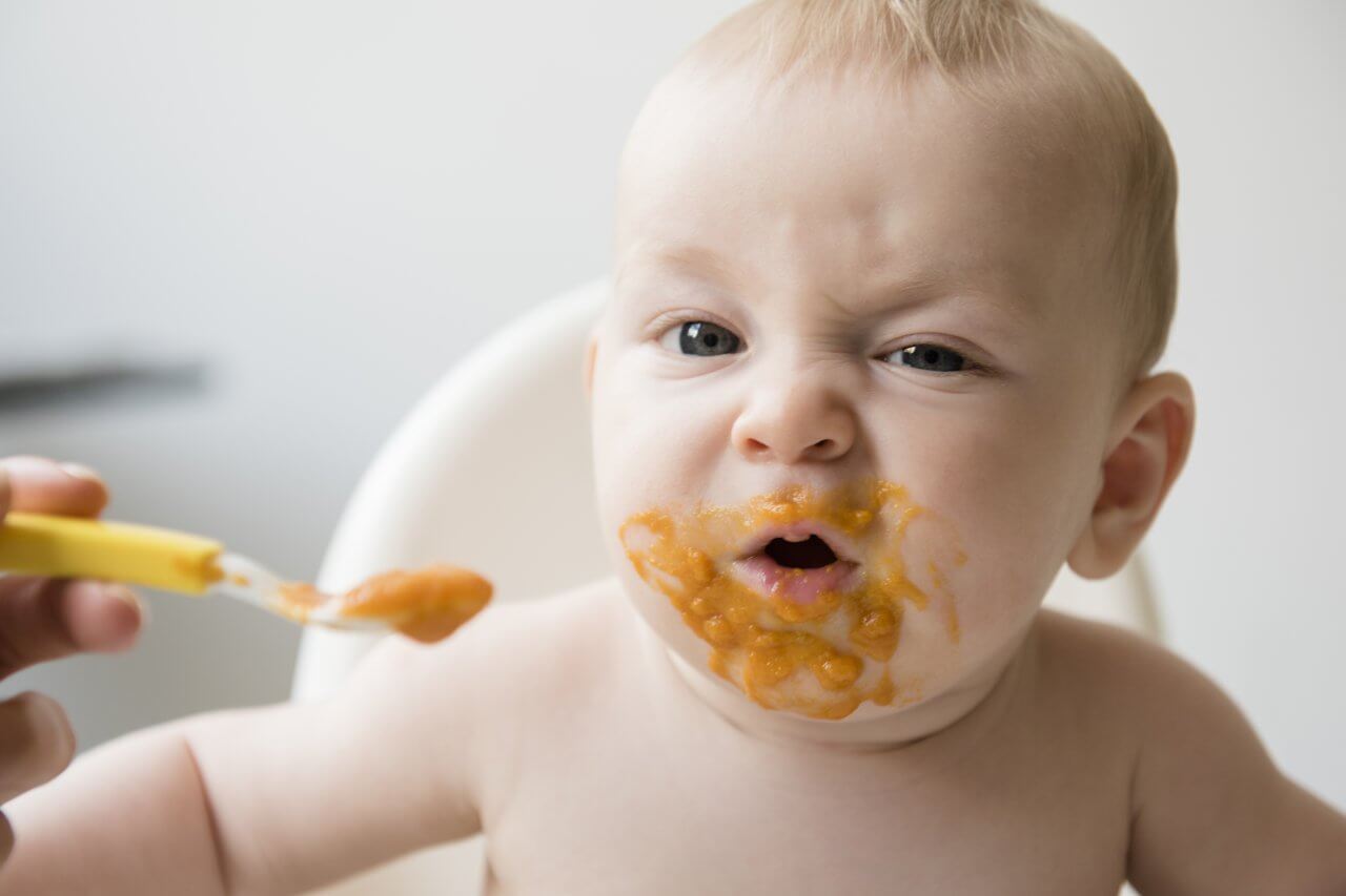 Baby eating hot sale food