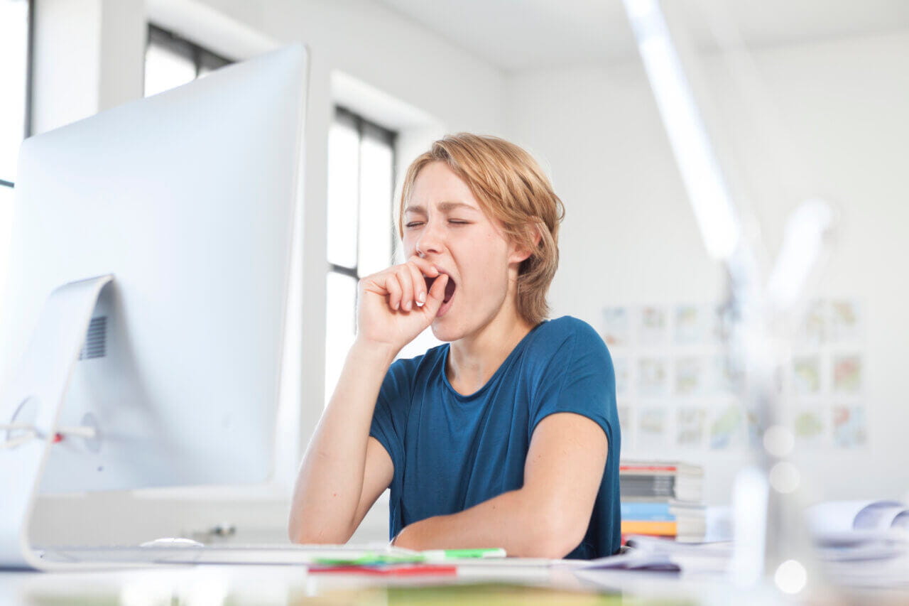 woman yawning and tired