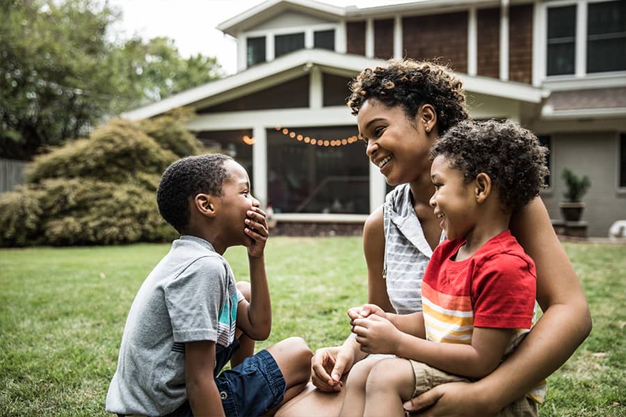 Family outside a house