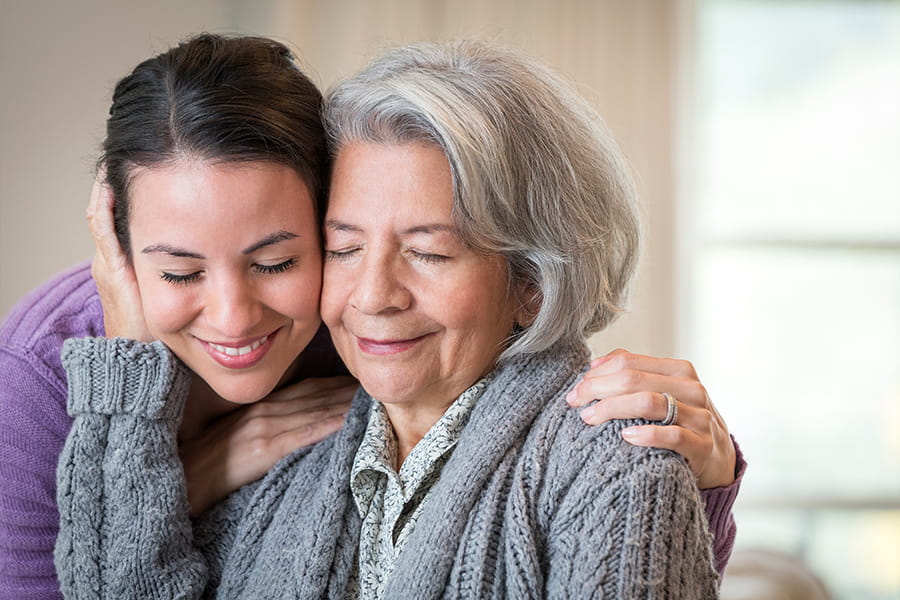 Mother and daughter embracing